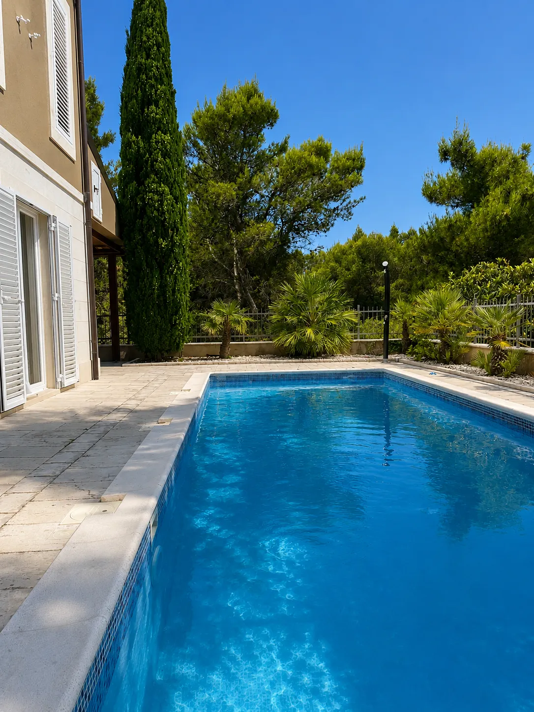 Private pool surrounded by Mediterranean greenery